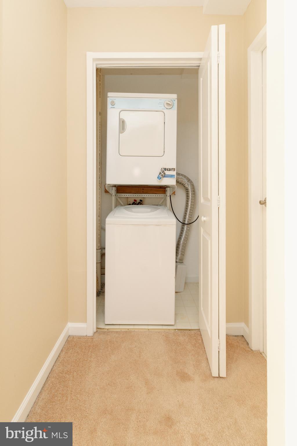 10570 Main Street, Unit 424 Fairfax, VA 22030 - Photo 13 of 18 a room that has a rug and a window