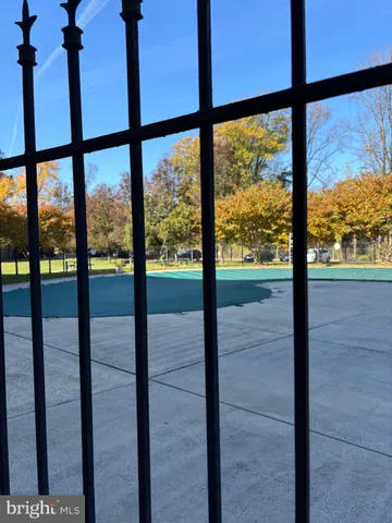 a view of an empty room with a floor to ceiling window