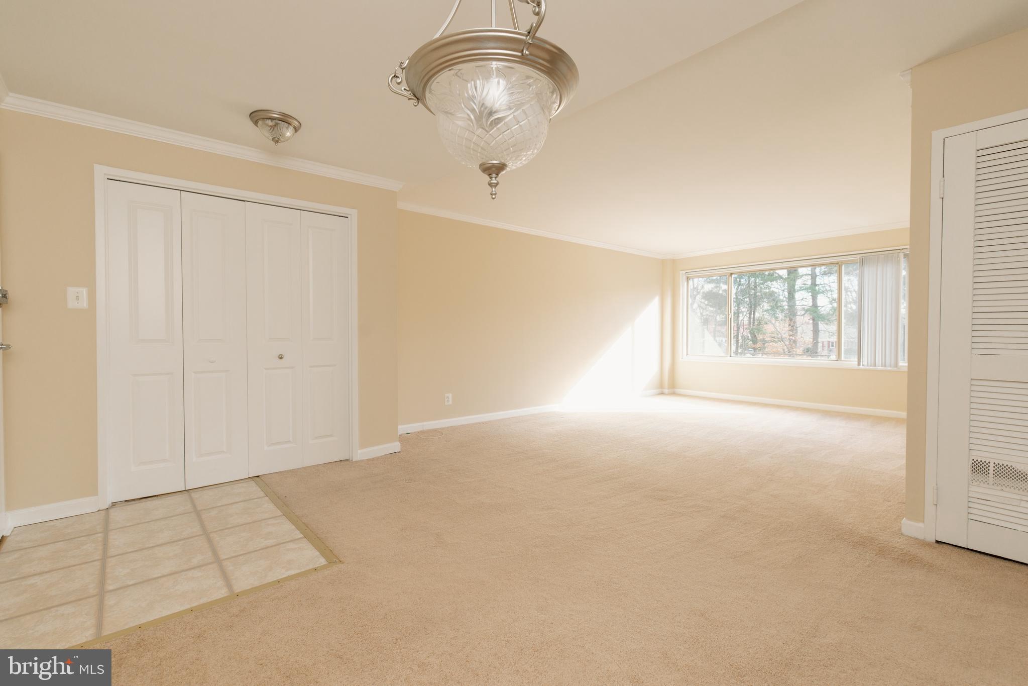 10570 Main Street, Unit 424 Fairfax, VA 22030 - Photo 2 of 18 a view of an empty room with a window