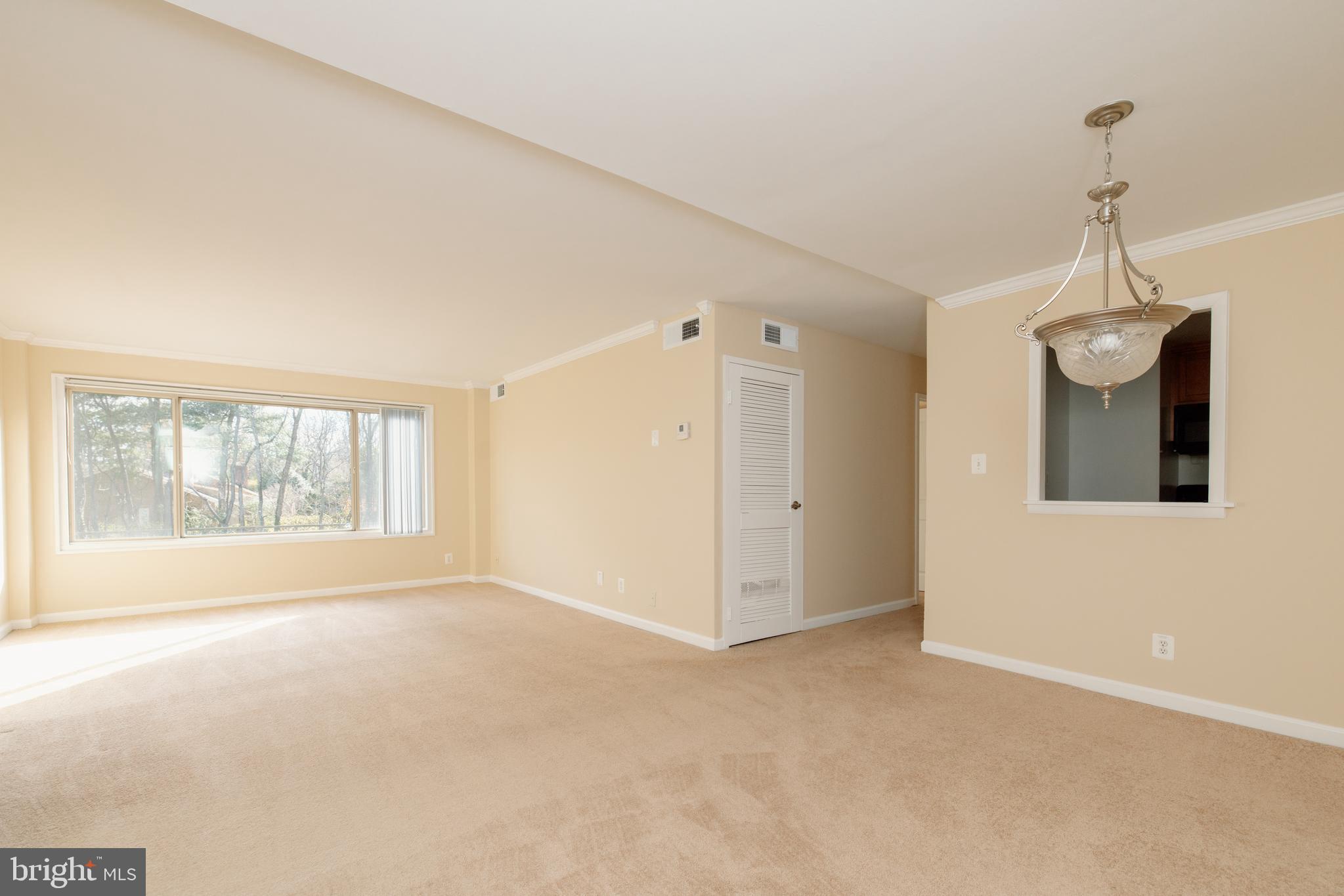 10570 Main Street, Unit 424 Fairfax, VA 22030 - Photo 4 of 18 a view of an empty room with a window