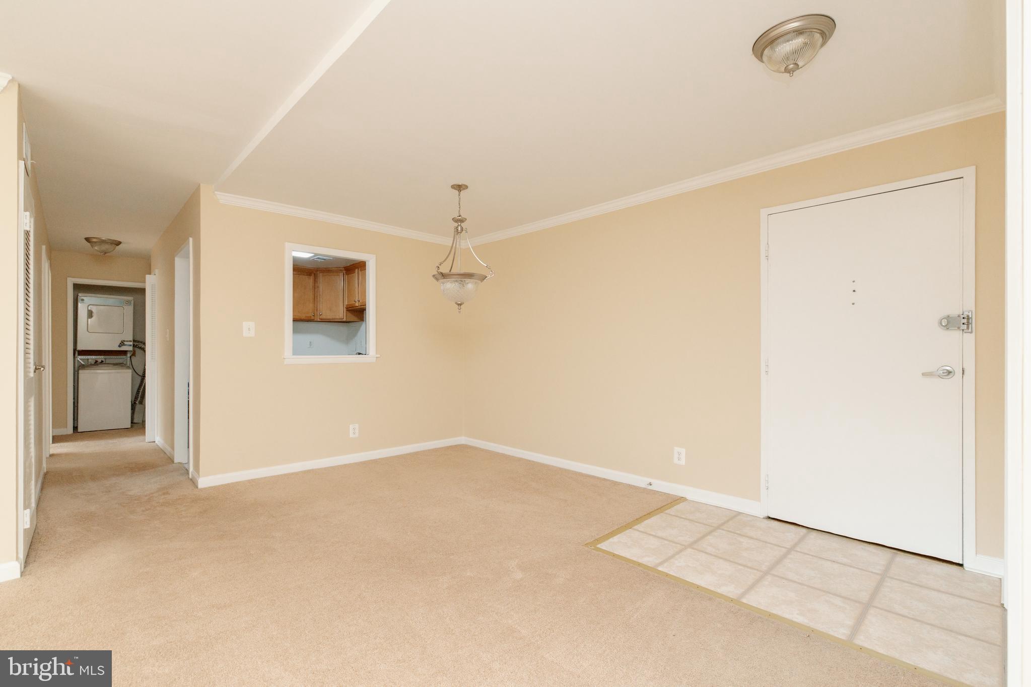10570 Main Street, Unit 424 Fairfax, VA 22030 - Photo 7 of 18 an empty room with a ceiling fan and a window