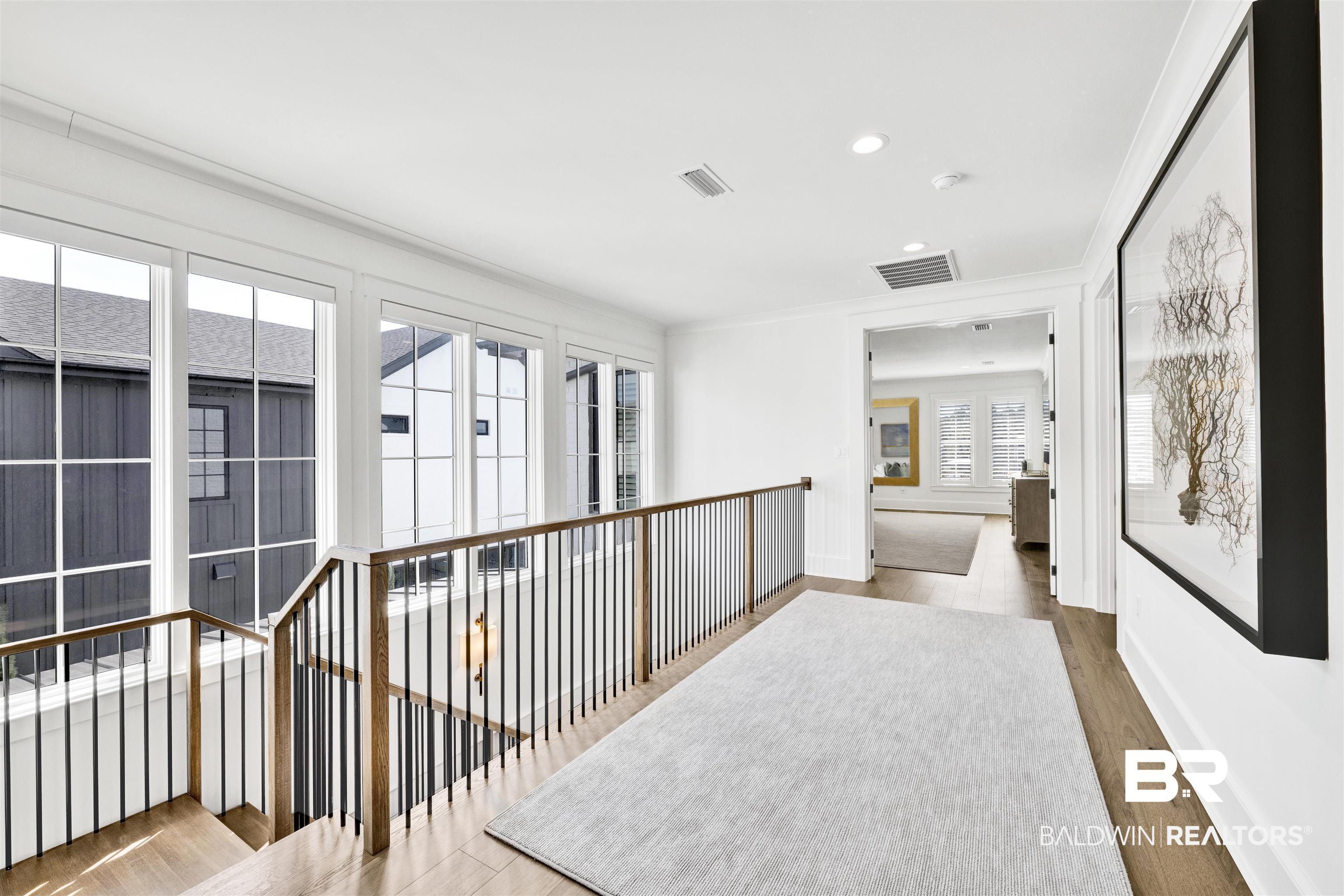861 Inlet Circle Gulf Shores, AL 36542 - Photo 22 of 54 Corridor with light wood finished floors, ornamental molding, an upstairs landing, and recessed lighting