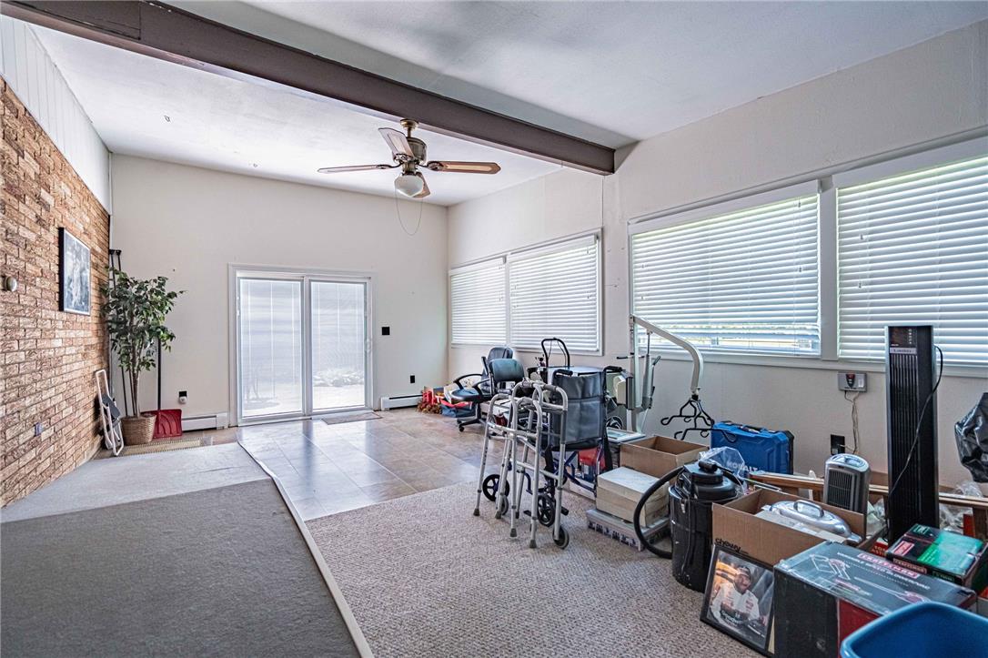 579 Cherry Road Northampton, PA 18067 - Photo 25 of 57 A spacious, naturally illuminated 4 season sunroom featuring a distinctive brick accent wall and convenient patio access.