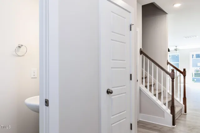 a bathroom with a sink a mirror and a window
