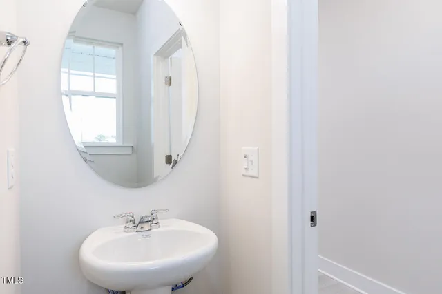 a view of an empty room with a ceiling fan