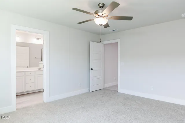 a bathroom with a shower sink and mirror
