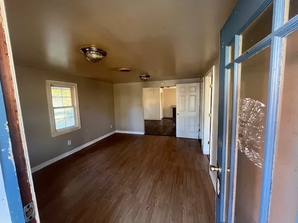 a view of an empty room with a window