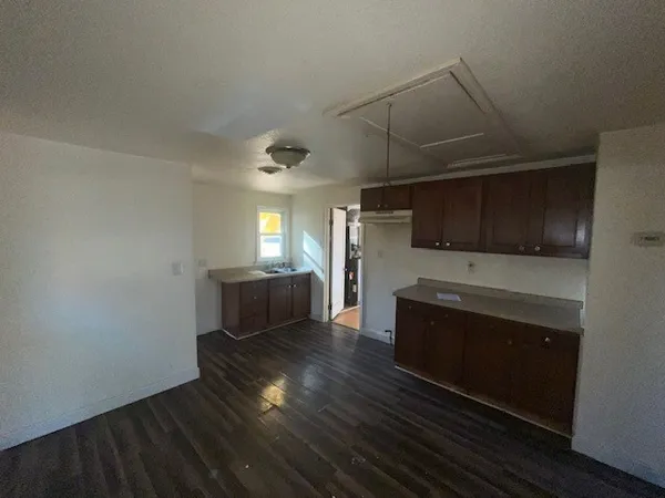 a kitchen with sink and cabinets