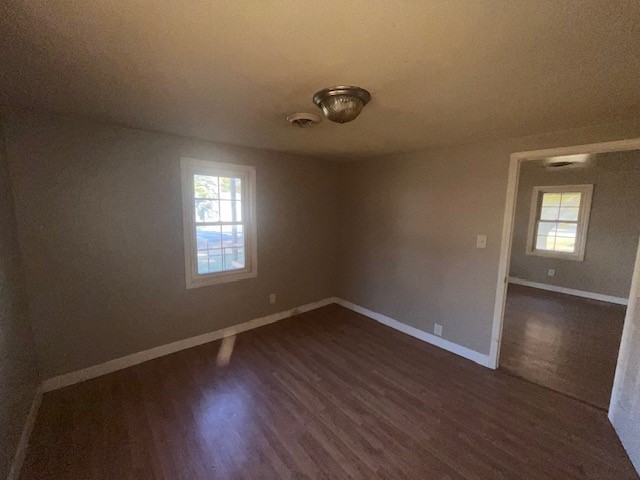 2025 East Pythian Avenue Decatur, IL 62526 - Photo 9 of 15 an empty room with wooden floor and windows