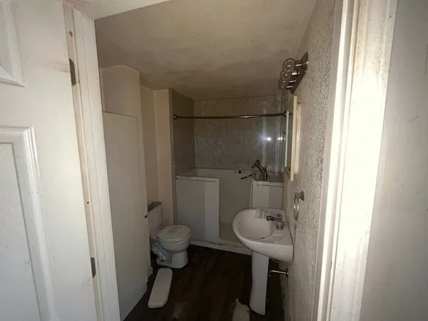 a bathroom with a sink and toilet