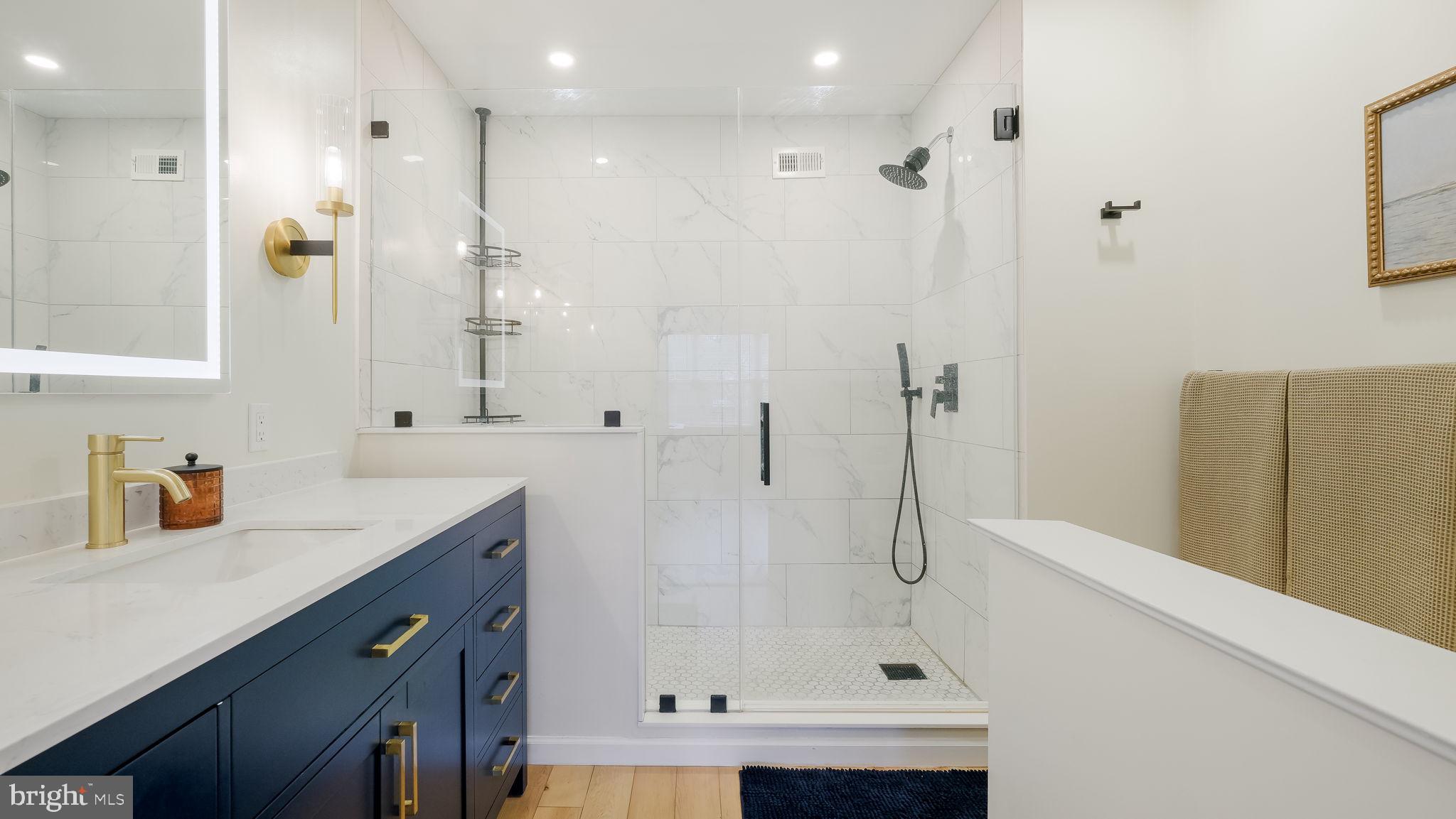 84 Trafalgar Road Doylestown, PA 18901 - Photo 30 of 50 a bathroom with a shower sink and mirror