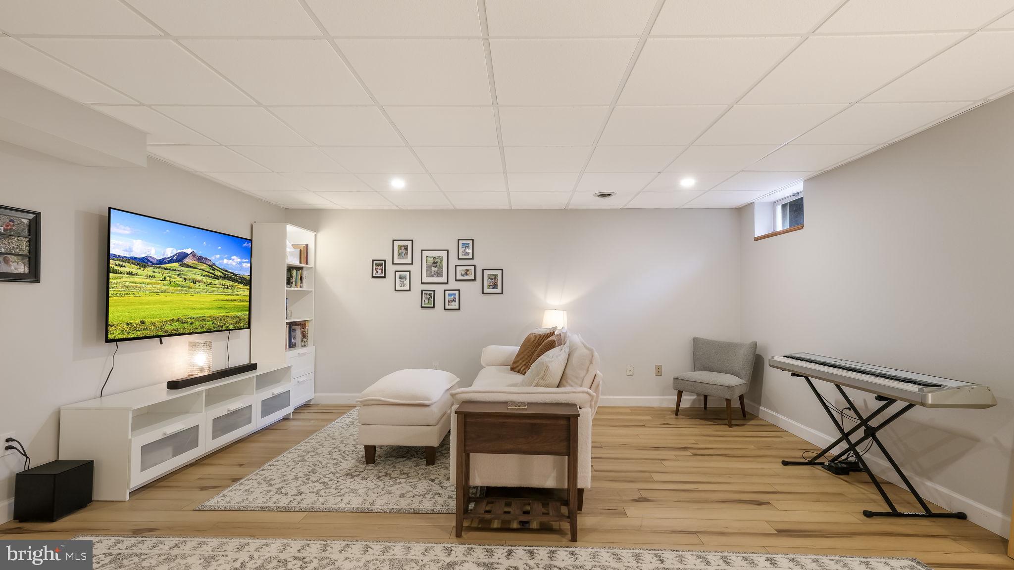 84 Trafalgar Road Doylestown, PA 18901 - Photo 42 of 50 a living room with furniture and a flat screen tv