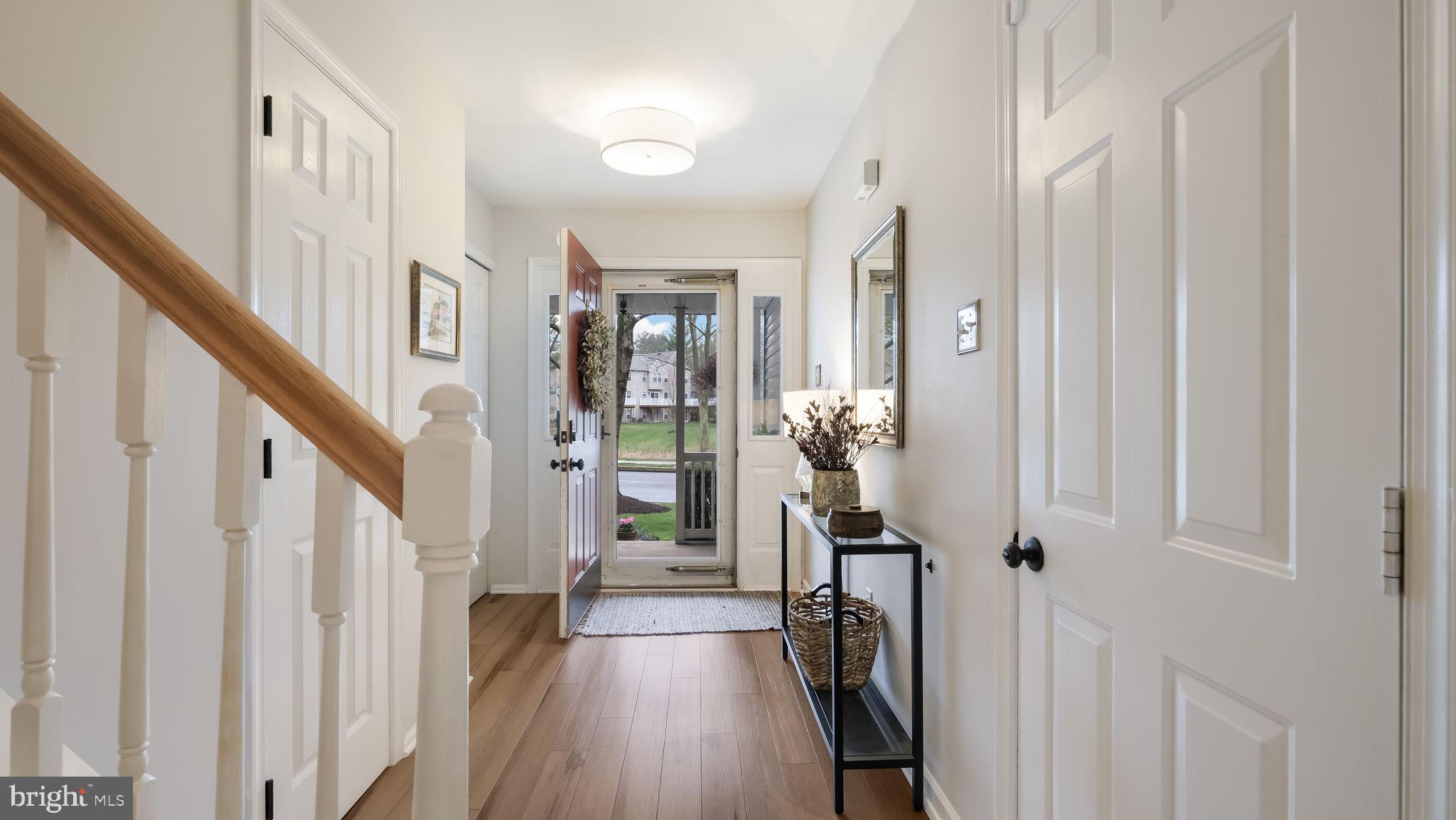 84 Trafalgar Road Doylestown, PA 18901 - Photo 9 of 50 a view of a hallway with wooden floor and stairs