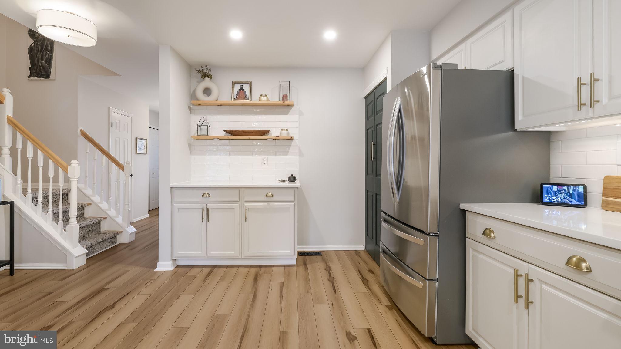 84 Trafalgar Road Doylestown, PA 18901 - Photo 10 of 50 a kitchen with white cabinets and stainless steel appliances