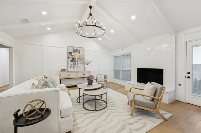 a view of a livingroom with furniture and a chandelier