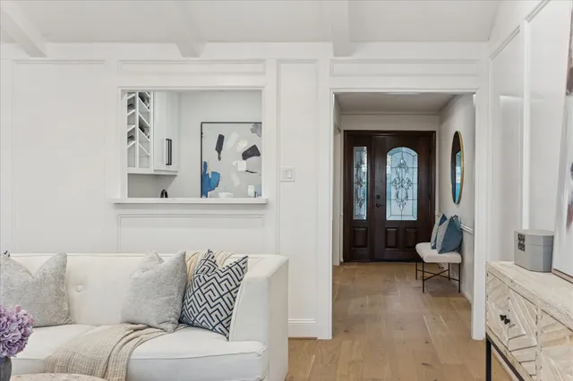 a living room with furniture and a painting