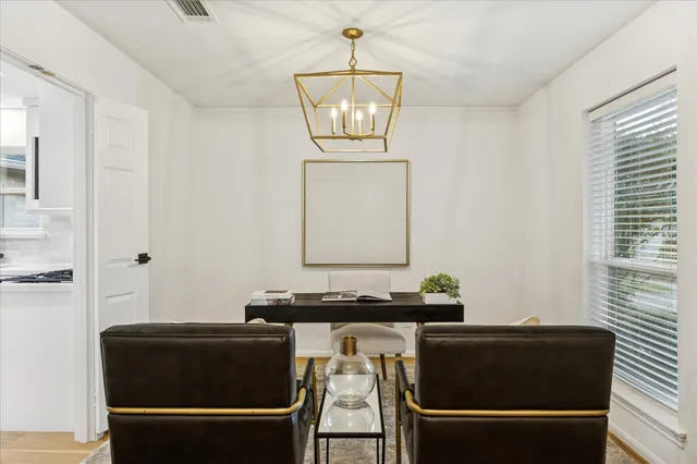 a living room with a bed and a window