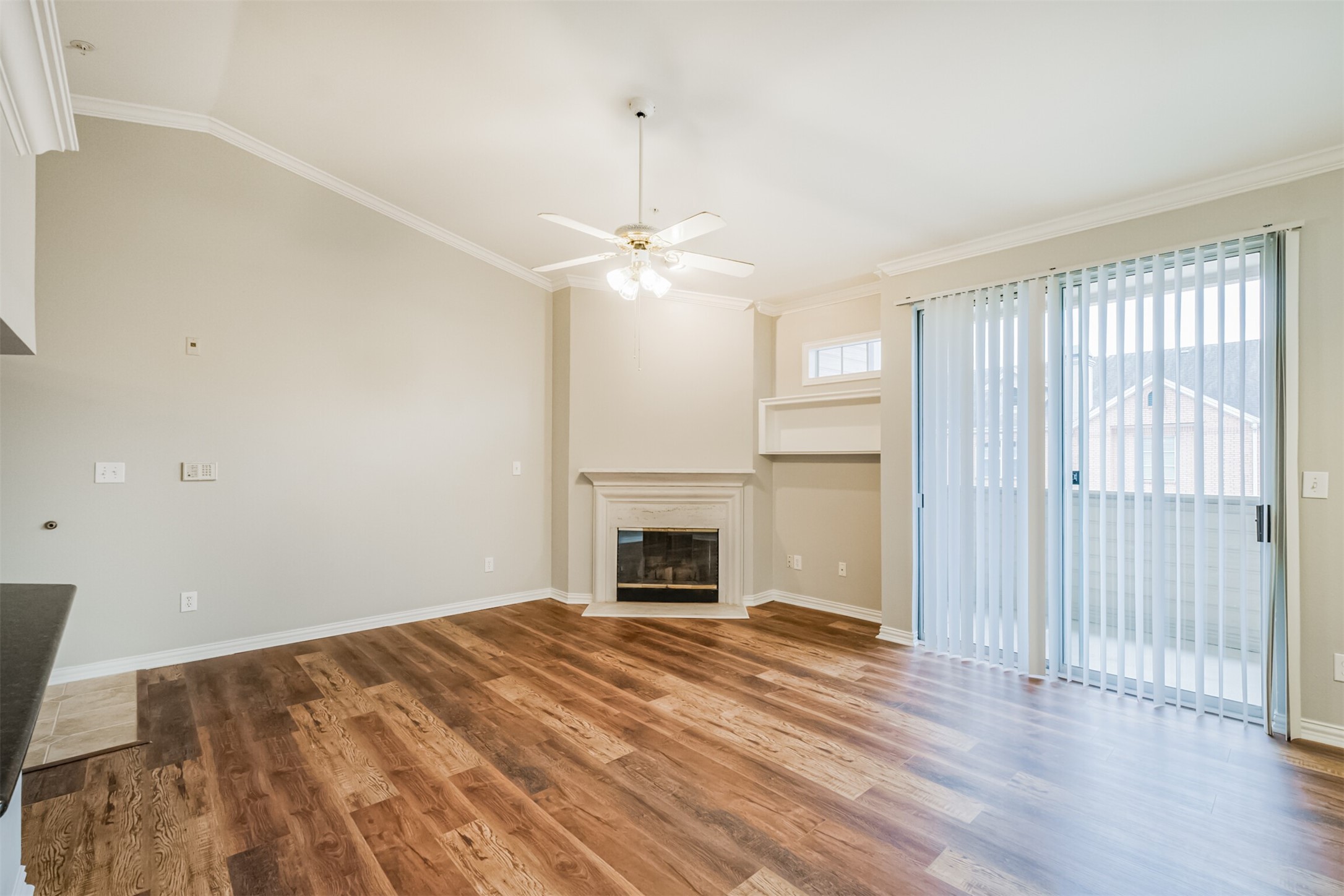 2111 Welch Street, Unit B304 Houston, TX 77019 - Photo 4 of 37 an empty room with windows and fireplace