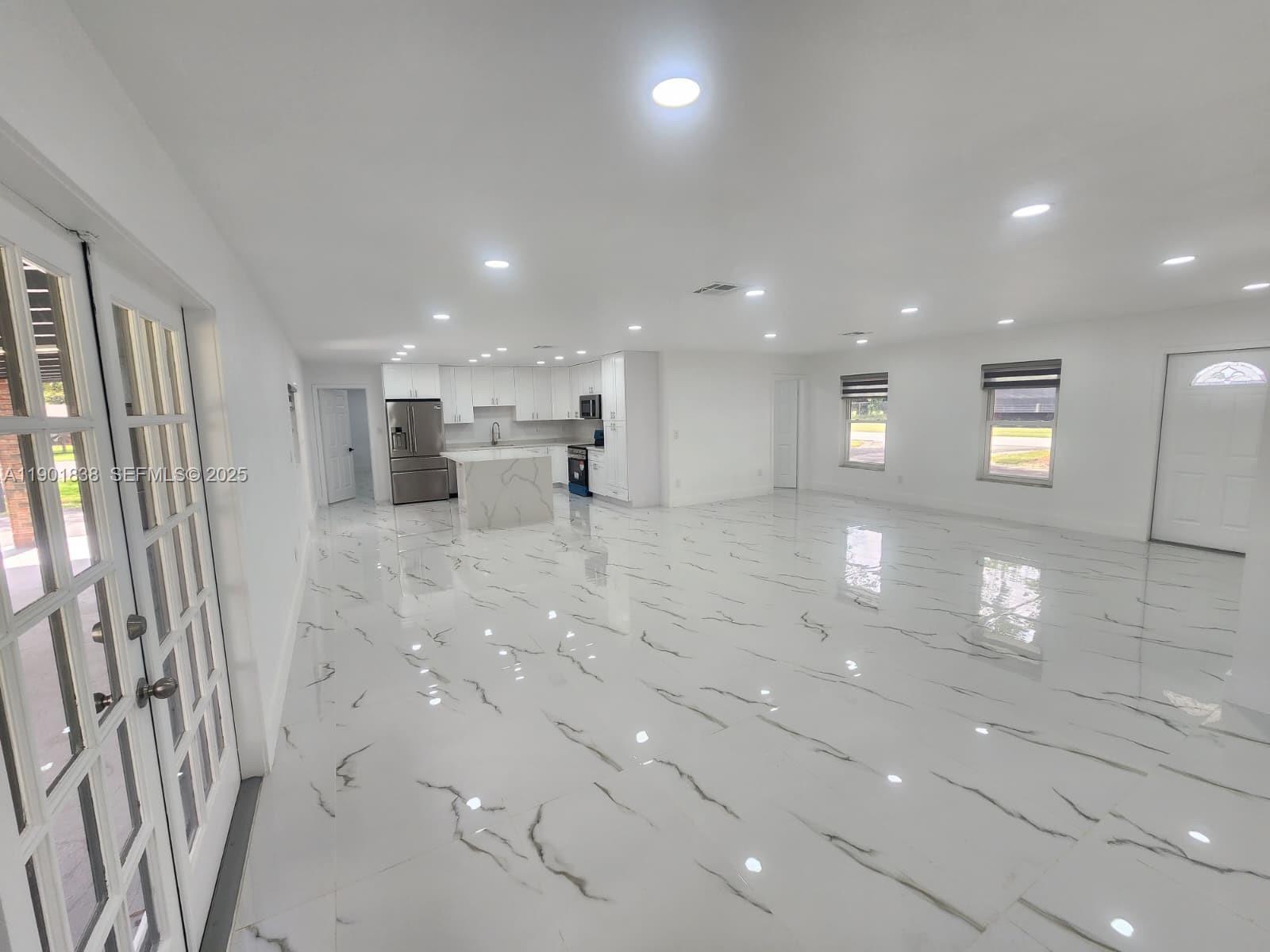 19621 Southwest 308th Street Homestead, FL 33030 - Photo 13 of 31 a view of empty room with wooden floor