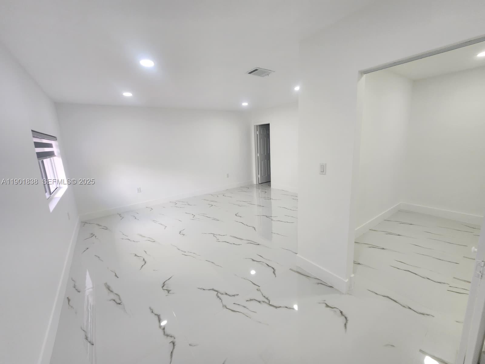 19621 Southwest 308th Street Homestead, FL 33030 - Photo 17 of 31 a view of a livingroom with wooden floor