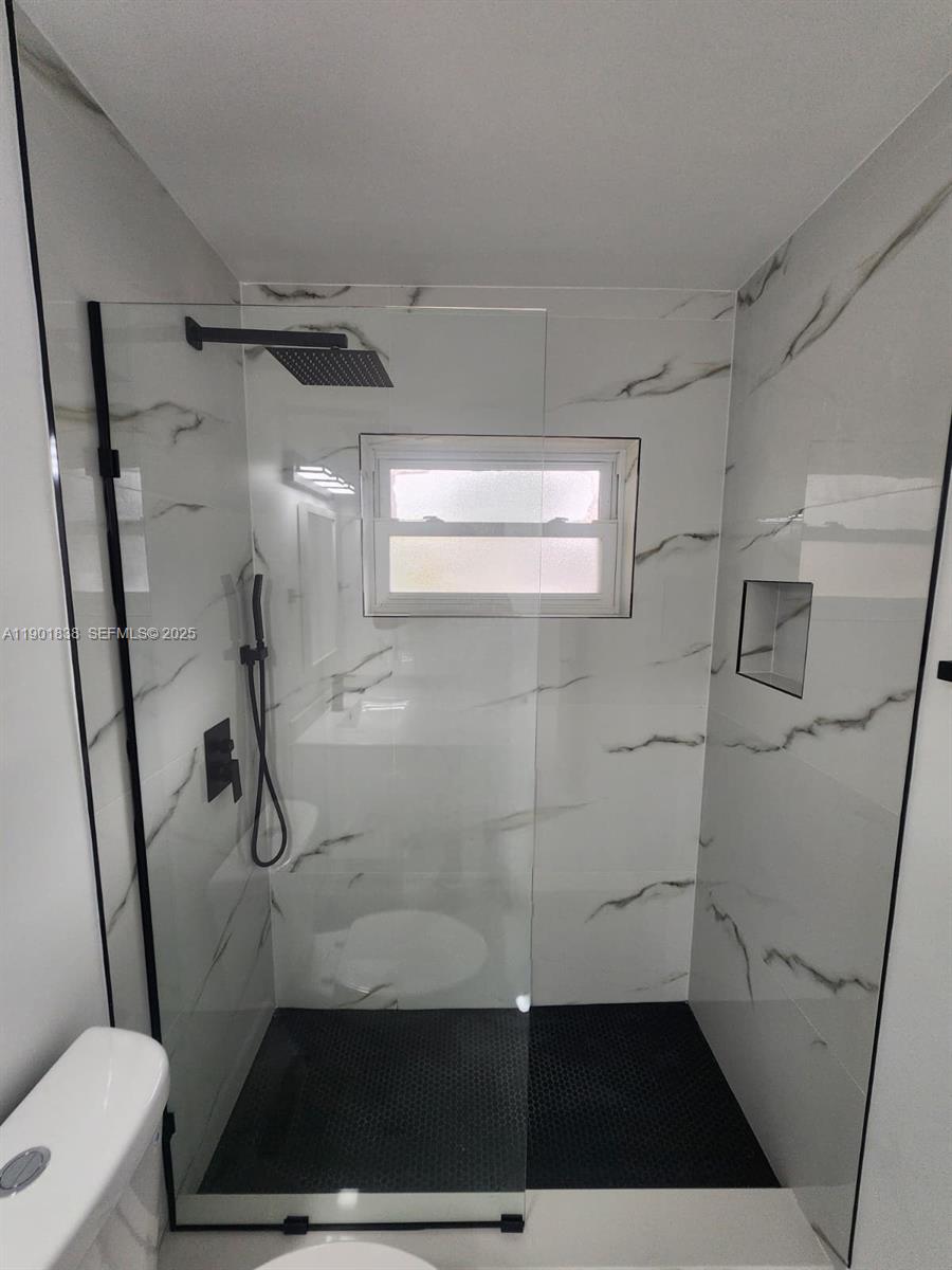 19621 Southwest 308th Street Homestead, FL 33030 - Photo 25 of 31 a bathroom with a shower