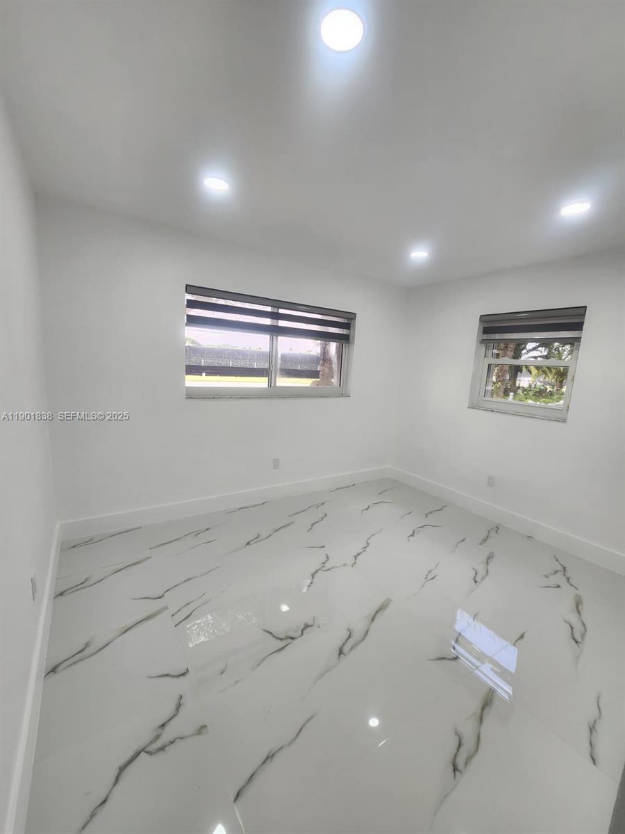 19621 Southwest 308th Street Homestead, FL 33030 - Photo 28 of 31 wooden floor in an empty room