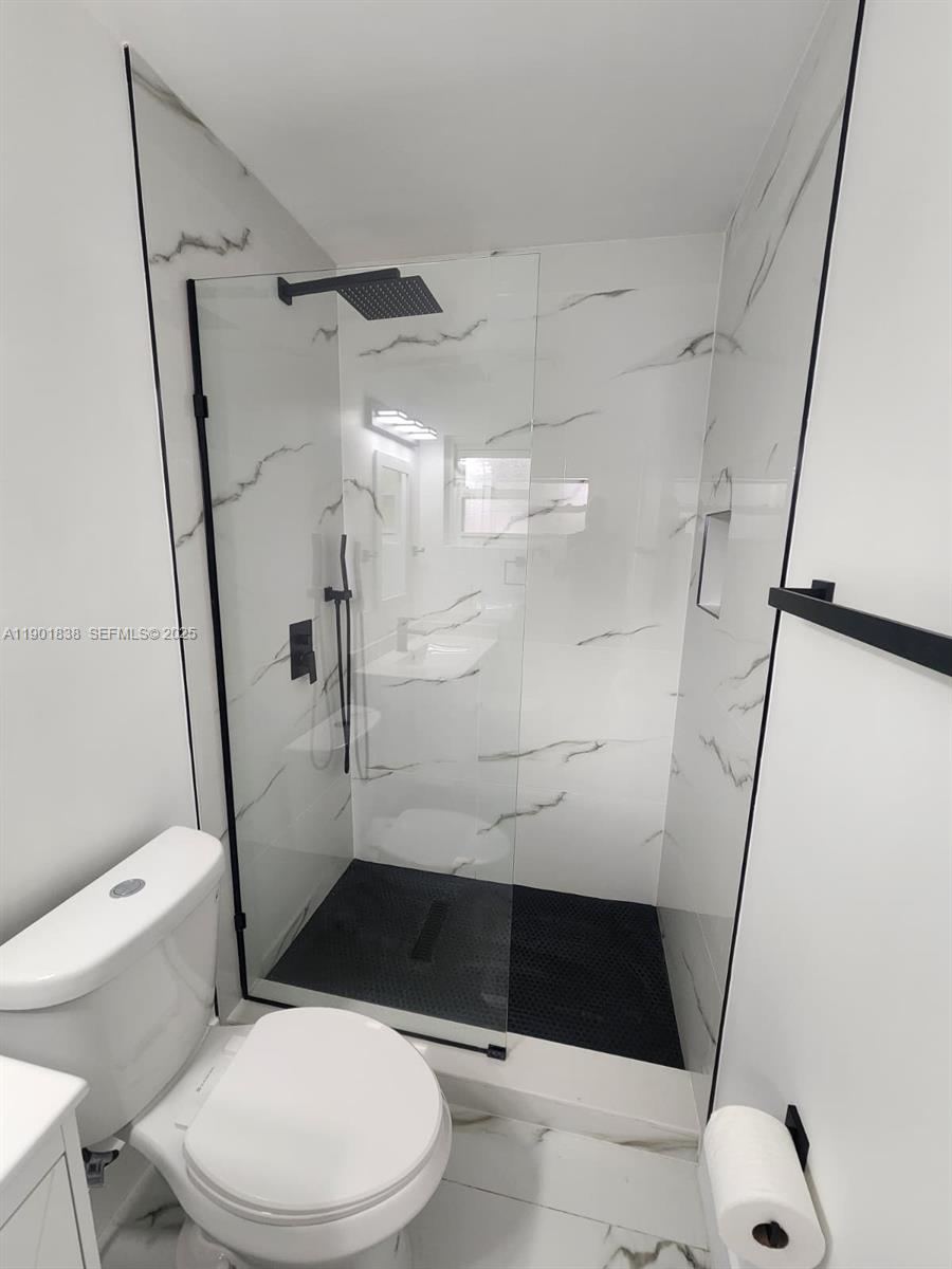 19621 Southwest 308th Street Homestead, FL 33030 - Photo 31 of 31 a bathroom with a toilet and a shower