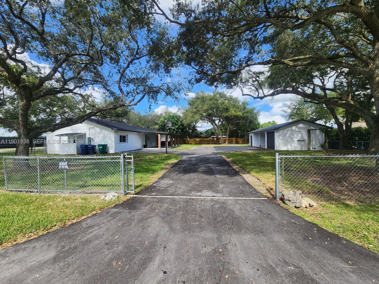 19621 Southwest 308th Street Homestead, FL 33030 - Photo 4 of 31 a view of backyard with green space