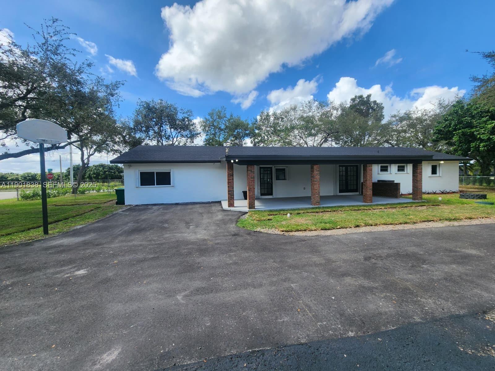 19621 Southwest 308th Street Homestead, FL 33030 - Photo 6 of 31 a view of a house with a swimming pool