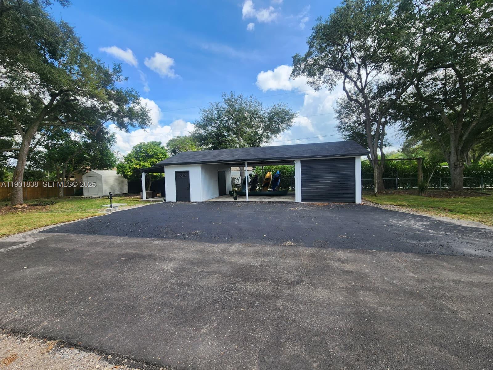 19621 Southwest 308th Street Homestead, FL 33030 - Photo 7 of 31 a view of house with yard and green space