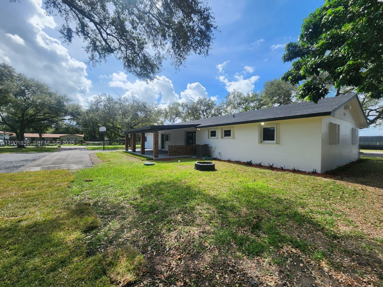 19621 Southwest 308th Street Homestead, FL 33030 - Photo 8 of 31 a view of a house with backyard and sitting area