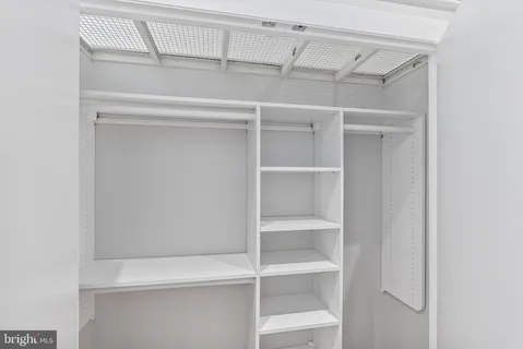 a view of an empty walk in closet