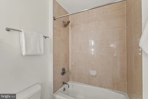 a bathroom with a shower and a tub