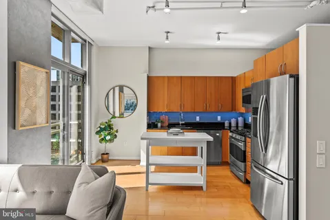 a living room with a couch and a dining table
