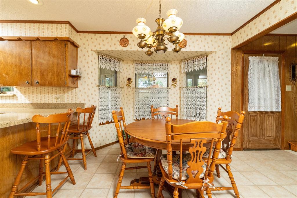 970 Live Oak Road Santo, TX 76472 - Photo 21 of 40 a dining room with furniture and chandelier