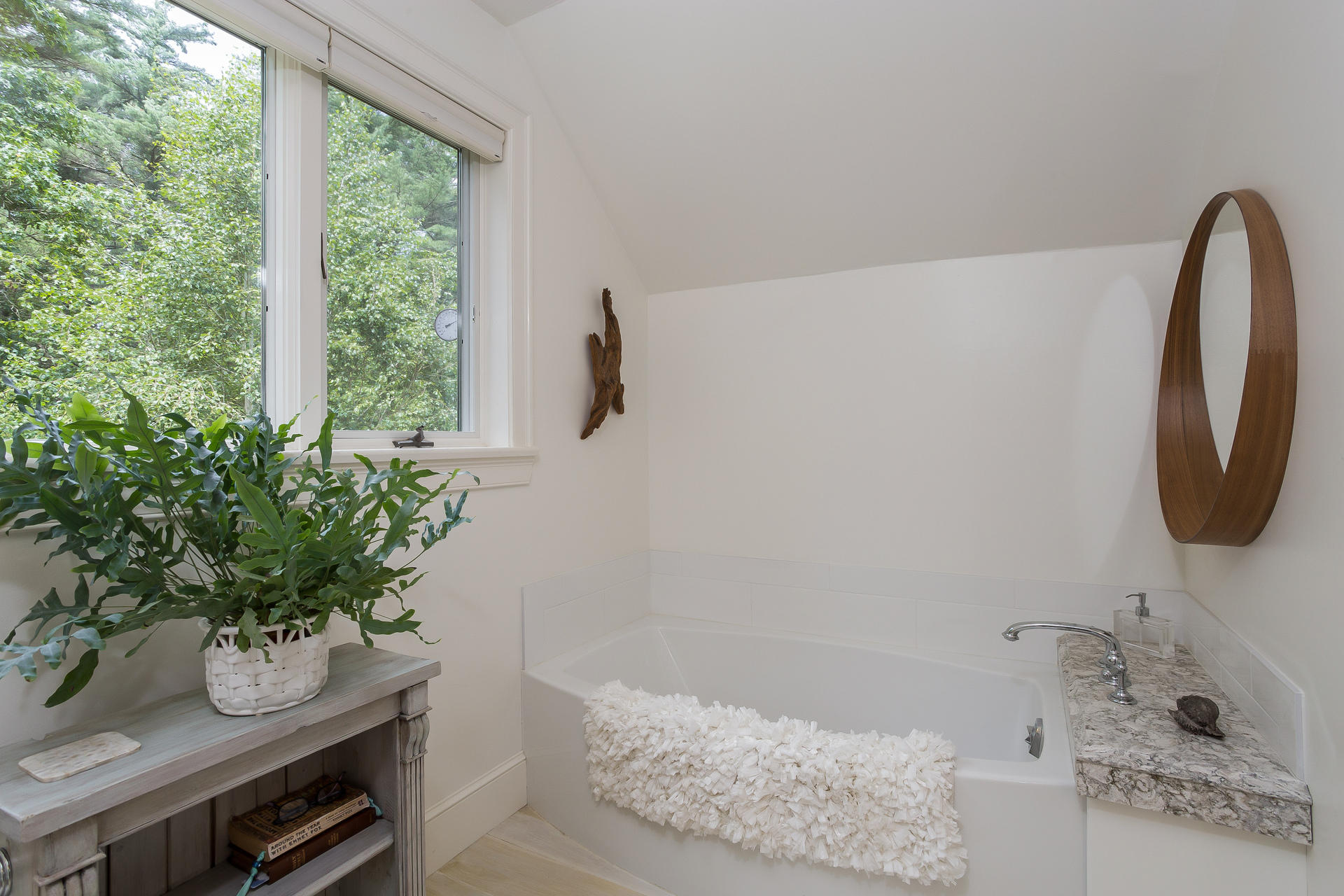 584 Delano Road Marion, MA 02738 - Photo 12 of 24 a bath tub sitting in a bathroom next to a window