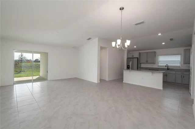 a view of a kitchen with a sink and cabinets