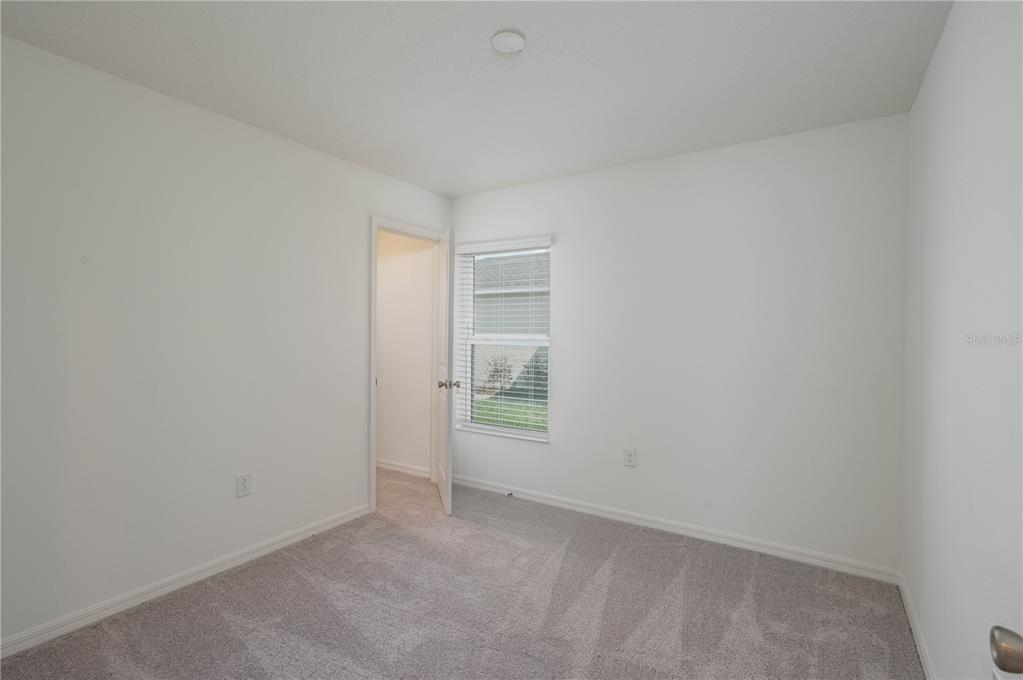 622 Meadows Edge Place Lake Wales, FL 33859 - Photo 7 of 9 a view of an empty room and window