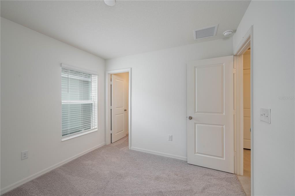 622 Meadows Edge Place Lake Wales, FL 33859 - Photo 9 of 9 a view of an empty room with closet and a window