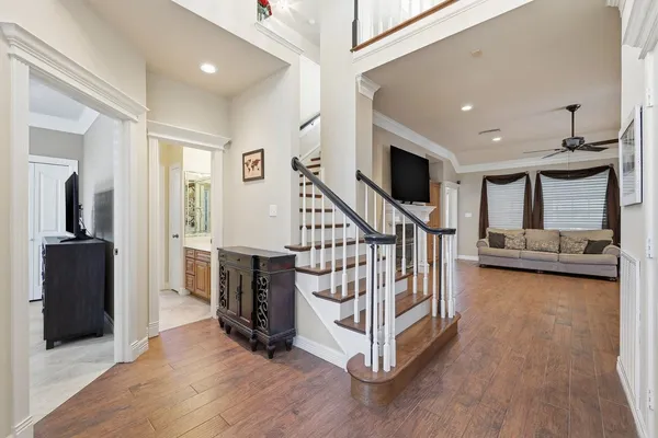 a view of entryway livingroom and hall with wooden floor
