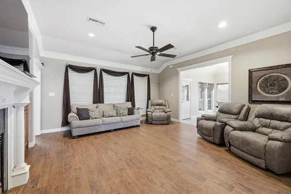 a living room with furniture and a fireplace