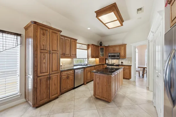 a dining room with furniture and window