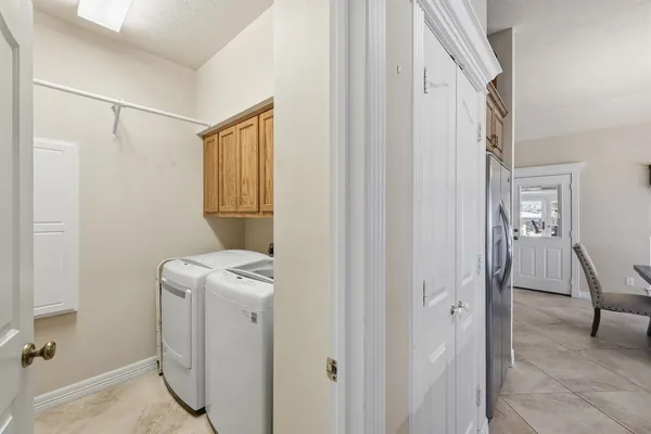 a bedroom with a bed and a television