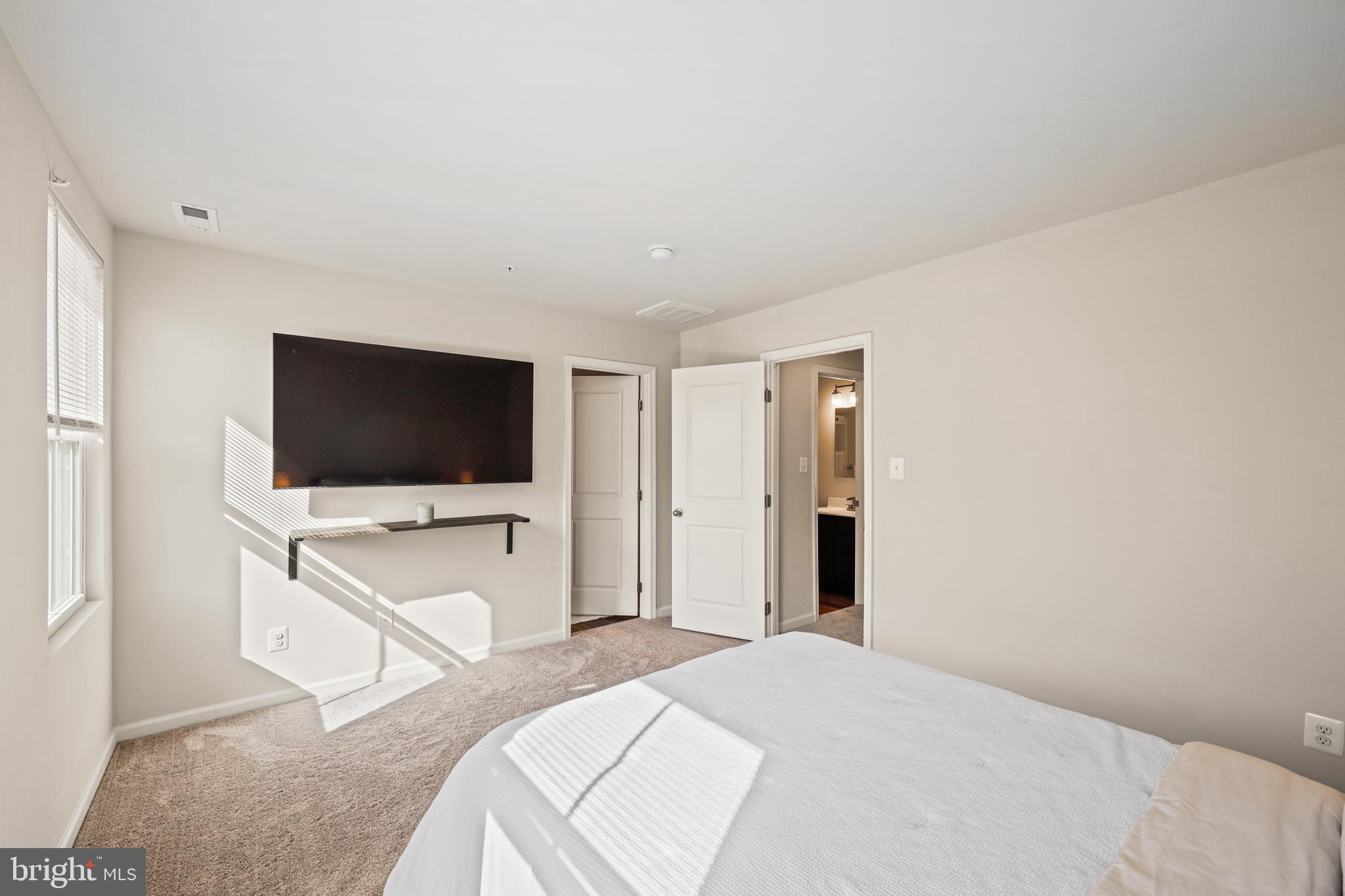 16 Azalea Circle Elkton, MD 21921 - Photo 14 of 30 a bedroom with a bed and a flat screen tv