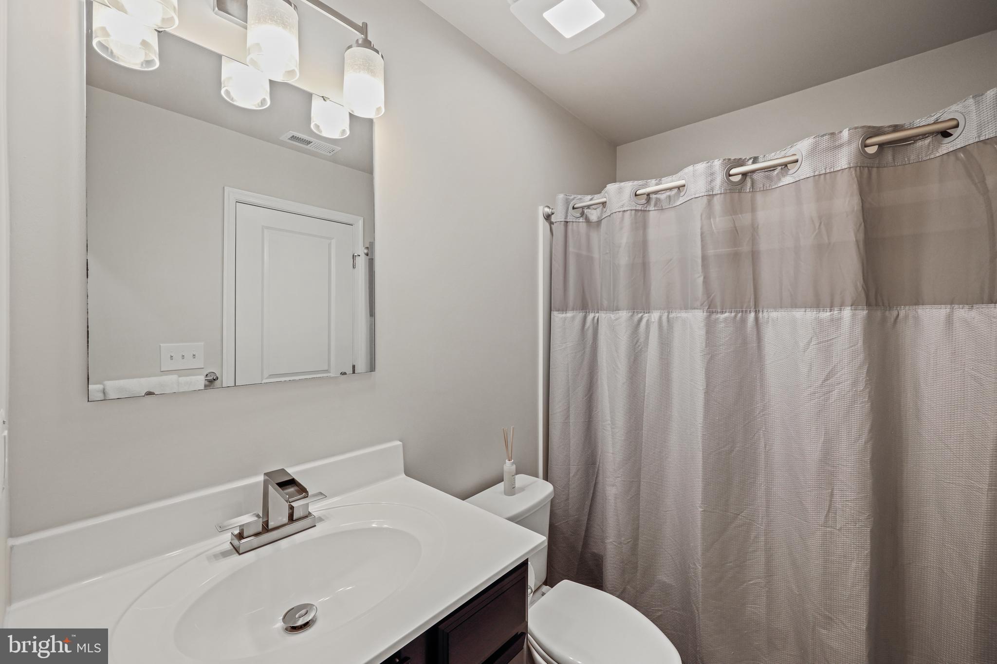 16 Azalea Circle Elkton, MD 21921 - Photo 16 of 30 a bathroom with a sink and a mirror