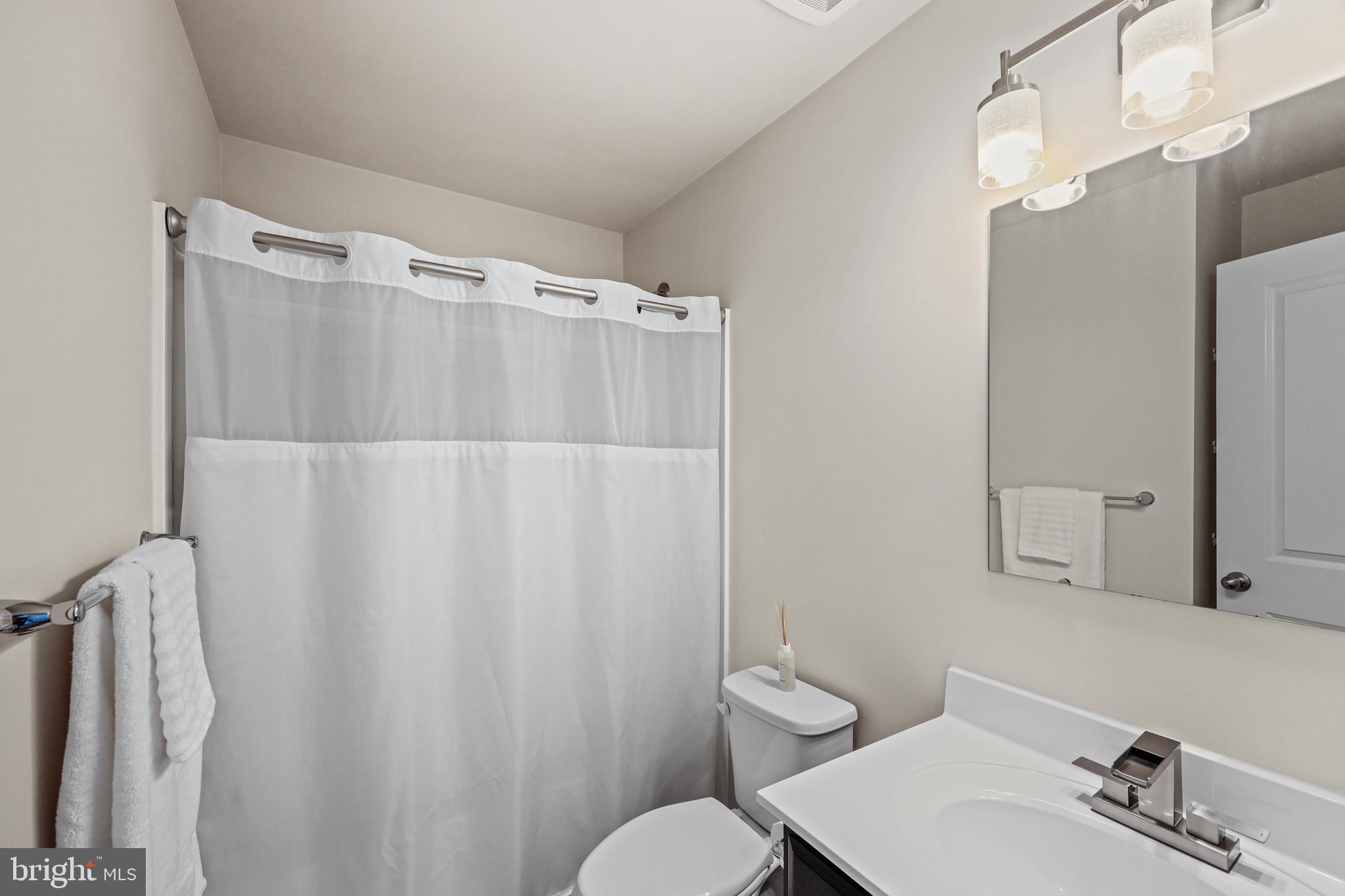 16 Azalea Circle Elkton, MD 21921 - Photo 24 of 30 a bathroom with a sink mirror and toilet