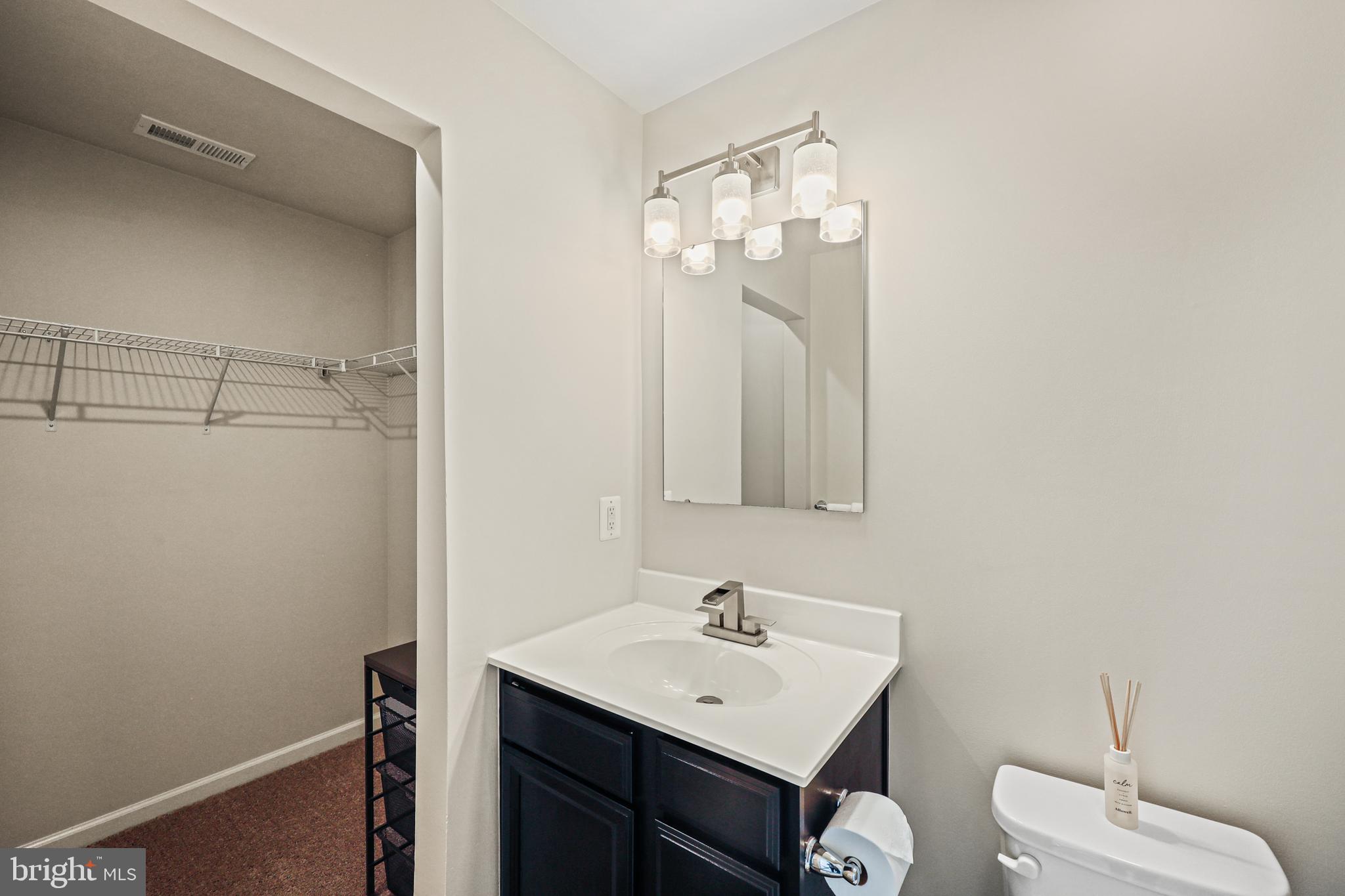 16 Azalea Circle Elkton, MD 21921 - Photo 4 of 30 a bathroom with a sink a toilet and mirror