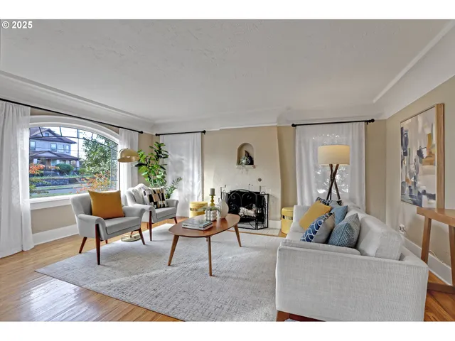 a living room with furniture and a fireplace