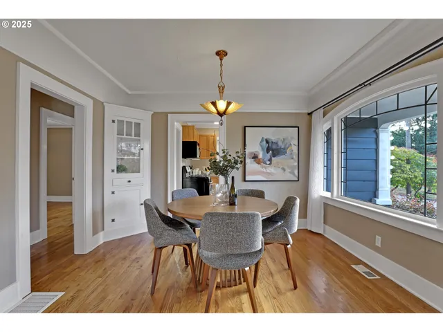 a dining room with furniture and window