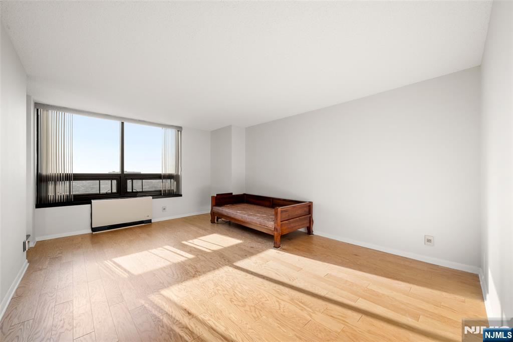 800 Palisade Avenue, Unit 1804 Fort Lee, NJ 07024 - Photo 10 of 23 a bedroom with a bed and a window